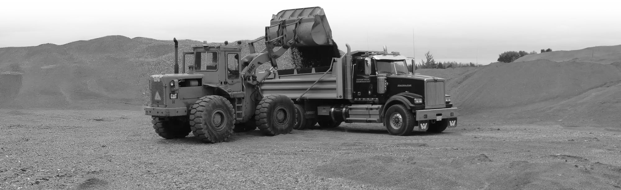 Bulldozer loading dump truck